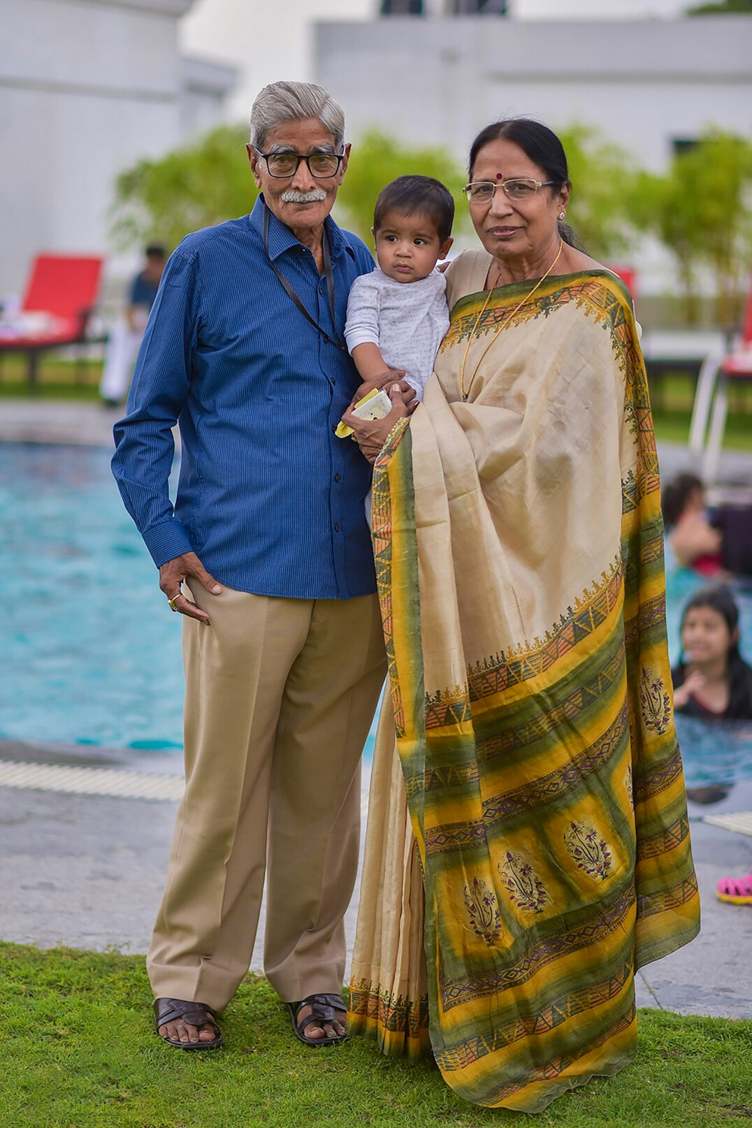 Grandmother, adult daughter and grandchild visiting a community center together