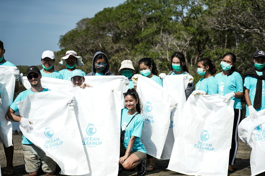 Friendly team of community center staff and volunteers smiling together