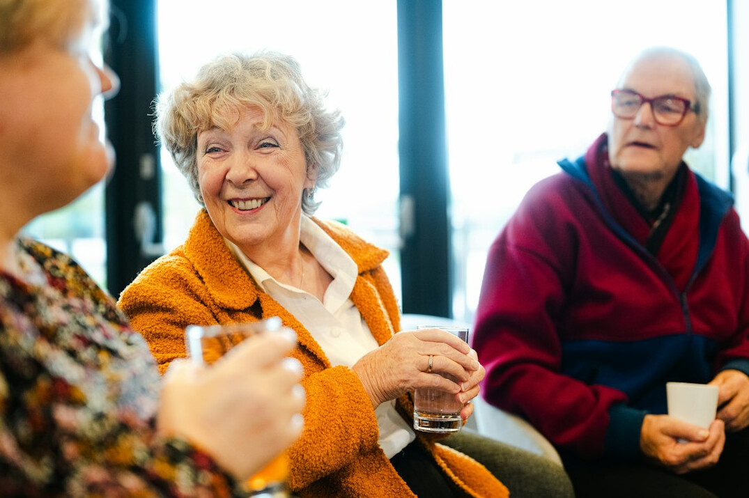 senior friends chatting in neighborhood