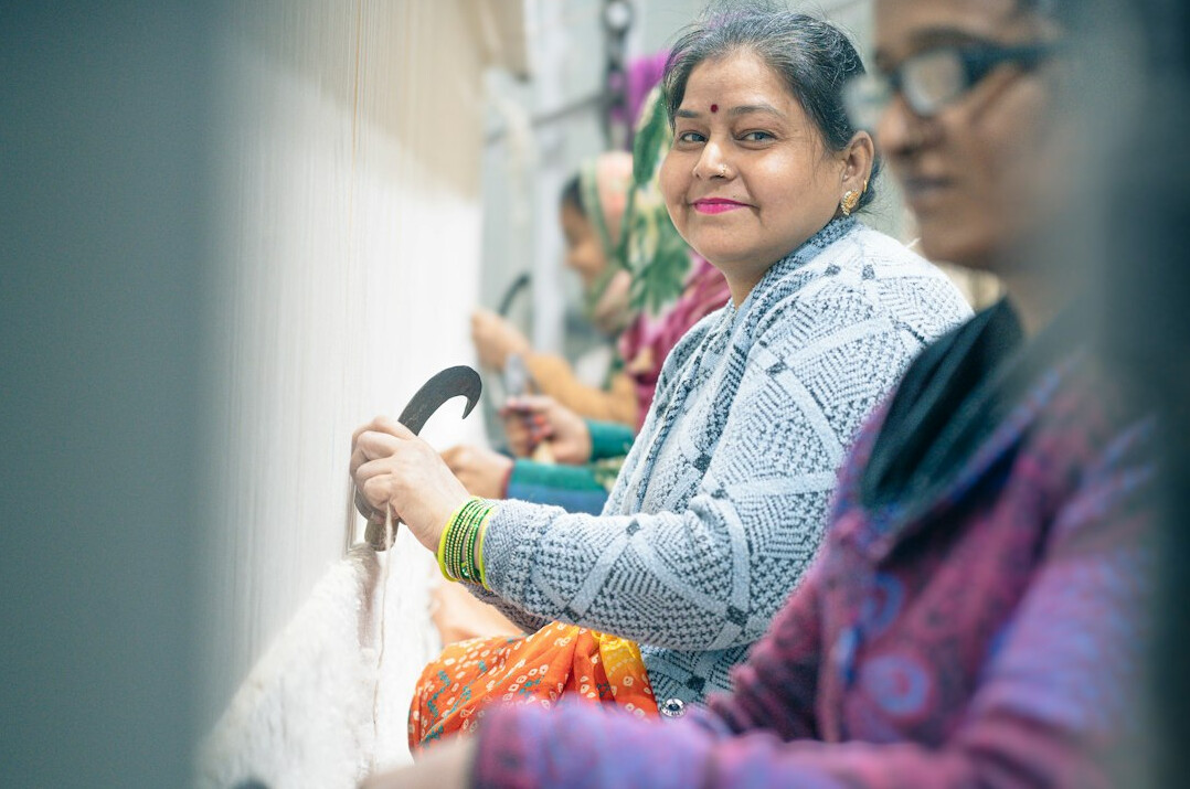 Group of older women knitting and doing handicrafts together