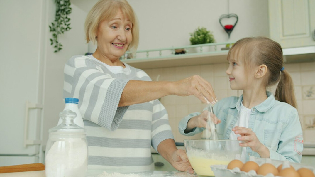 Seniors baking together in a community kitchen